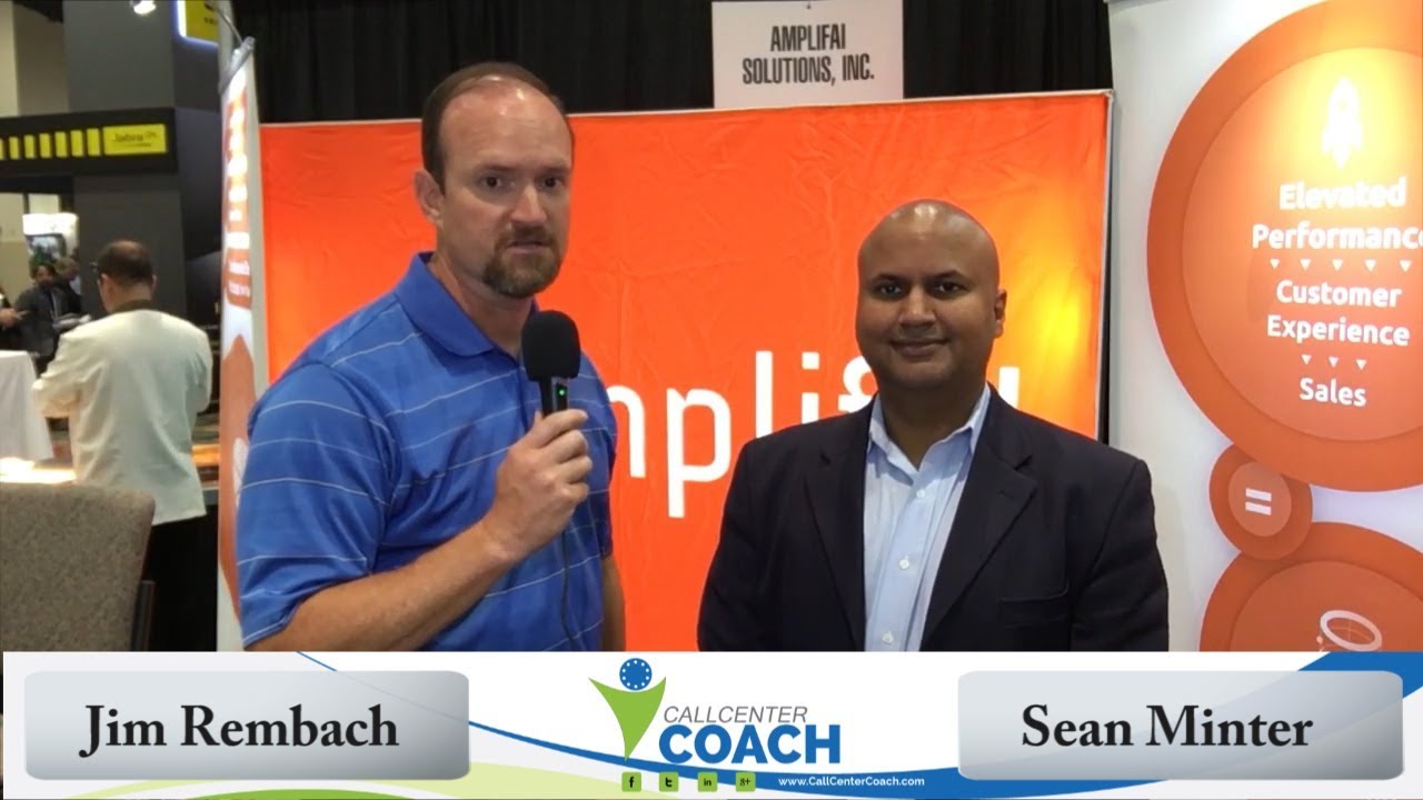 Jim Rembach, left, interviewing Sean Minter at an AmplifAI exhibition booth