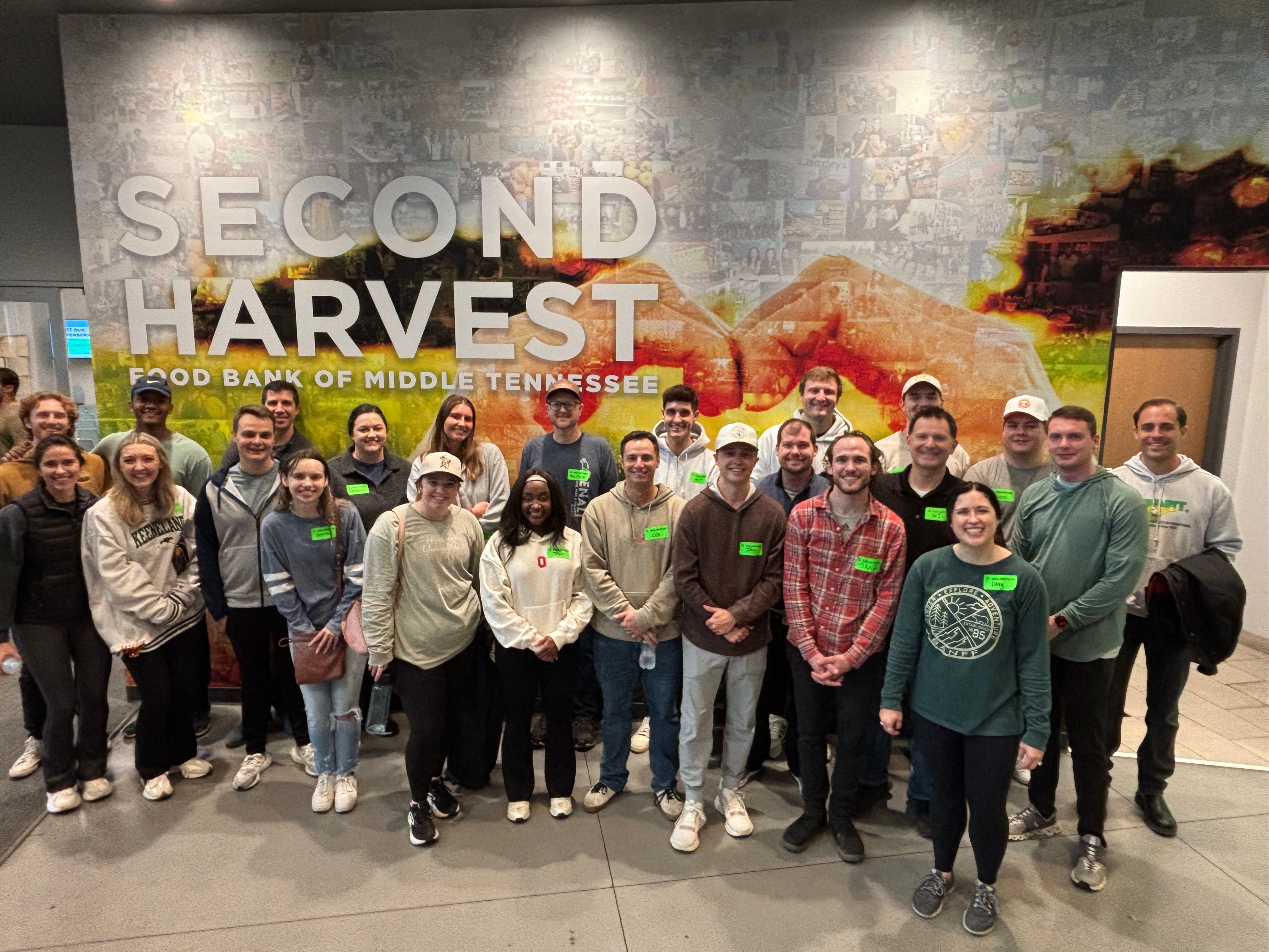 BluWave colleagues gathered at Second Harvest Food Bank during a team volunteering visit