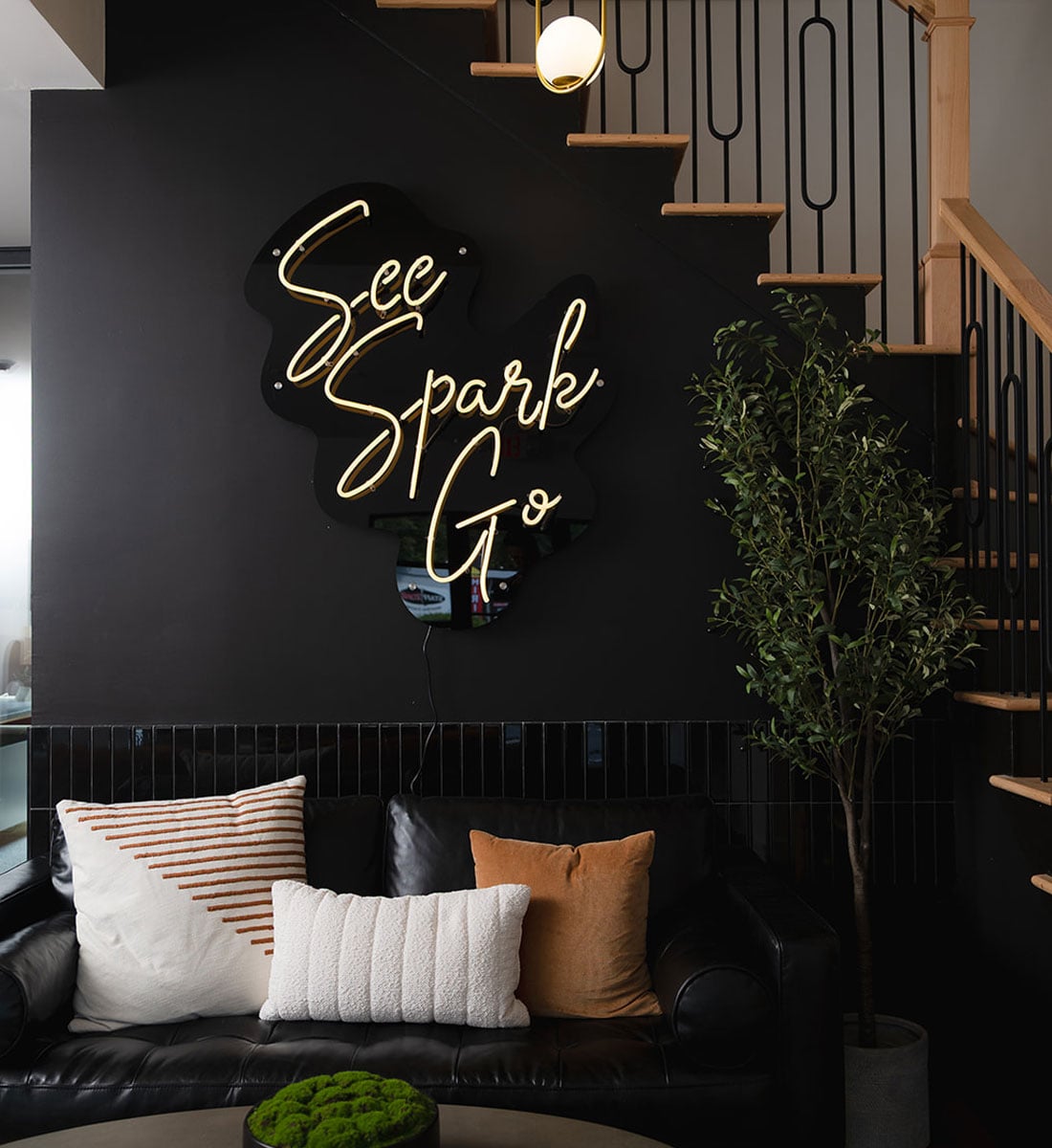 The See Spark Go neon sign in the agency's Athens office