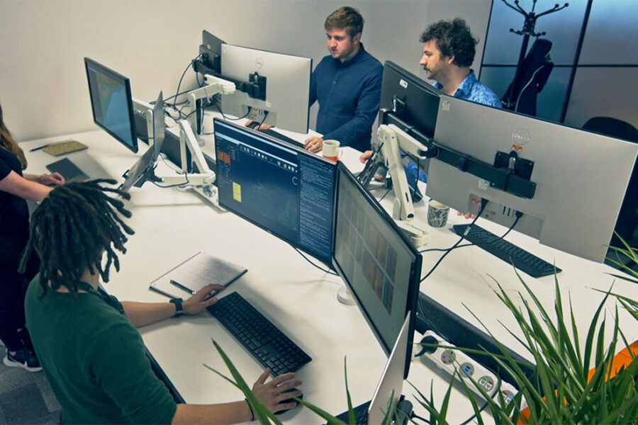 SeeByte staff working at multiple computer monitors in an office