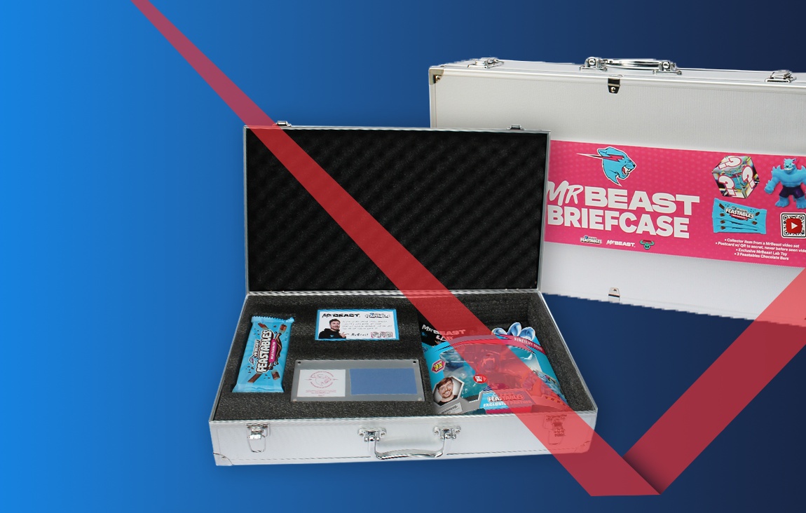 An open MrBeast Feastables briefcase containing collectibles and chocolate beside its retail packaging