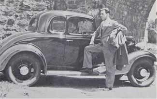 A Selective employee beside a company car around 1933