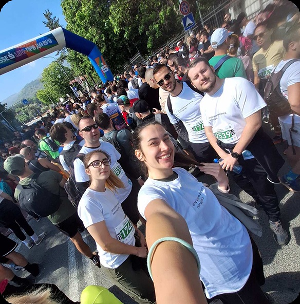 Semos Cloud colleagues taking a group selfie outdoors