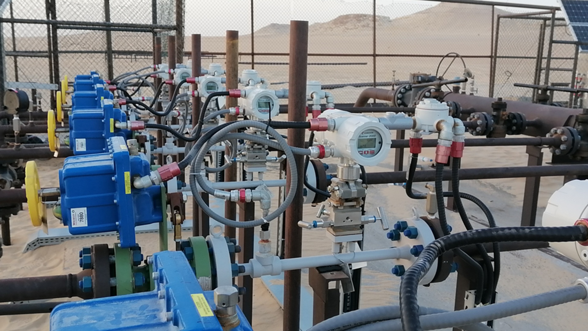 Flow computers, electric actuators and pipework in Sensia’s Sirte gas lift case-study photograph