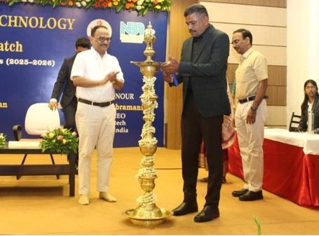 Senthil Paramasivam lighting a ceremonial brass lamp at Jansons Institute of Technology