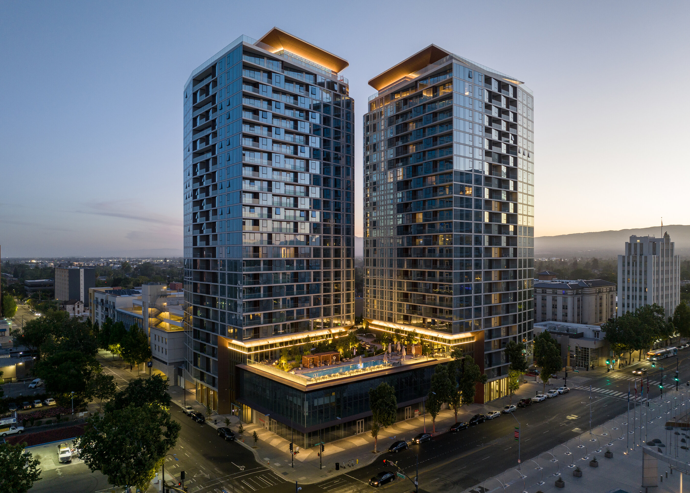 Miro residential towers in San Jose, seen above a courtyard and pool