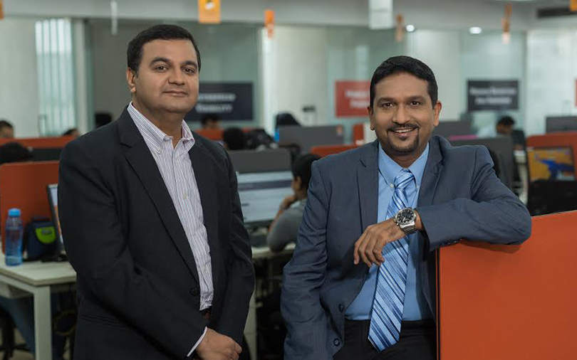 Sequretek co-founders Anand Naik, left, and Pankit Desai in an office