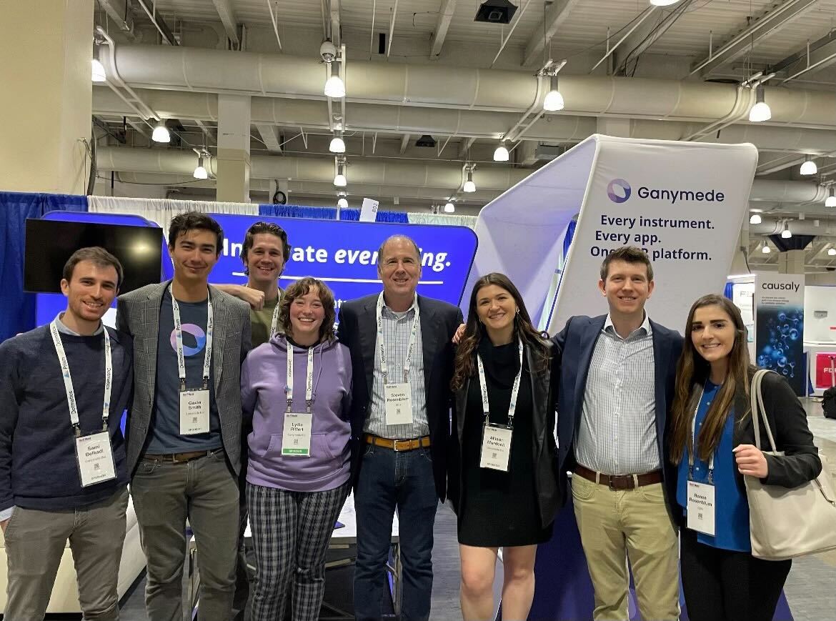 SER and Ganymede representatives together at a conference exhibition booth