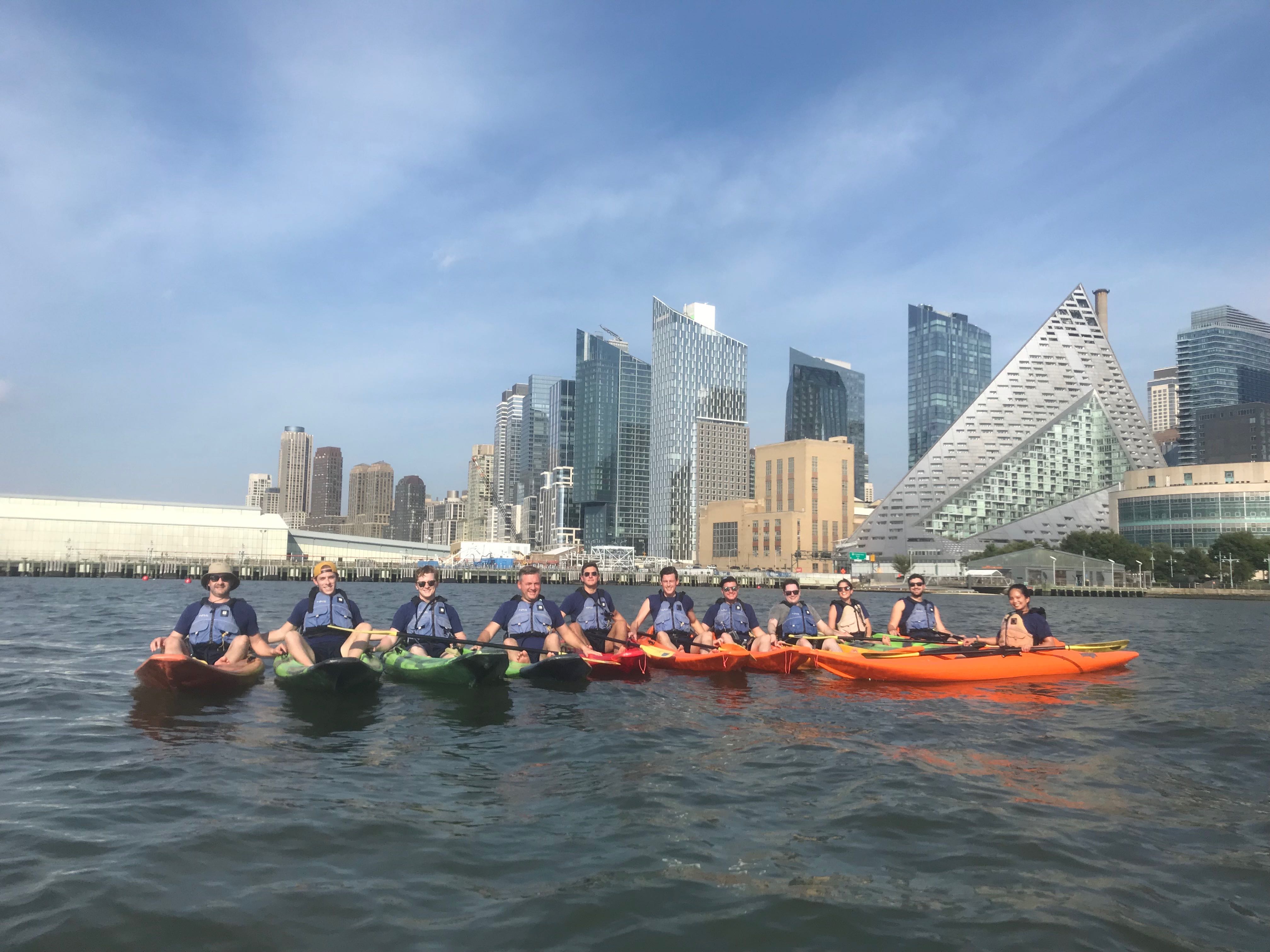 Braavo colleagues gathered in kayaks on the Hudson River during their 2019 New York offsite
