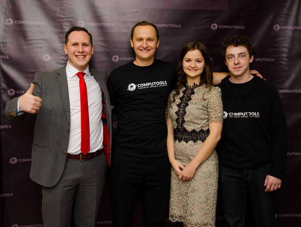 Sergii Tymchuk, second from left, with colleagues in front of a Computools backdrop
