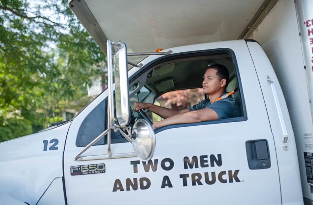 TWO MEN AND A TRUCK employee in a moving vehicle
