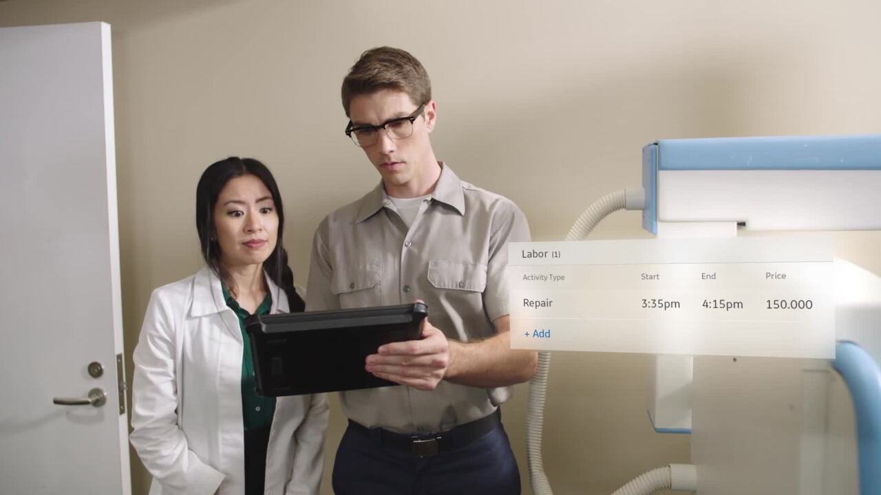 A staged ServiceMax Go demonstration shows a technician and customer reviewing a tablet beside medical equipment