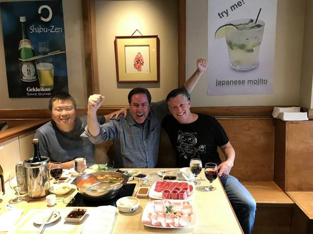 Seth Birnbaum, at right, enjoying a meal with friends