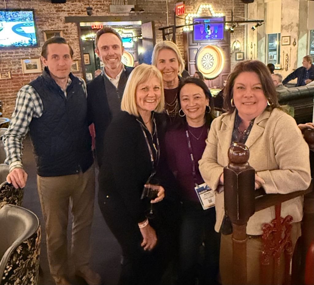 Seth Meyer at left, with Jeff Hutcheson and industry partners at Flight Club in Washington, D.C.