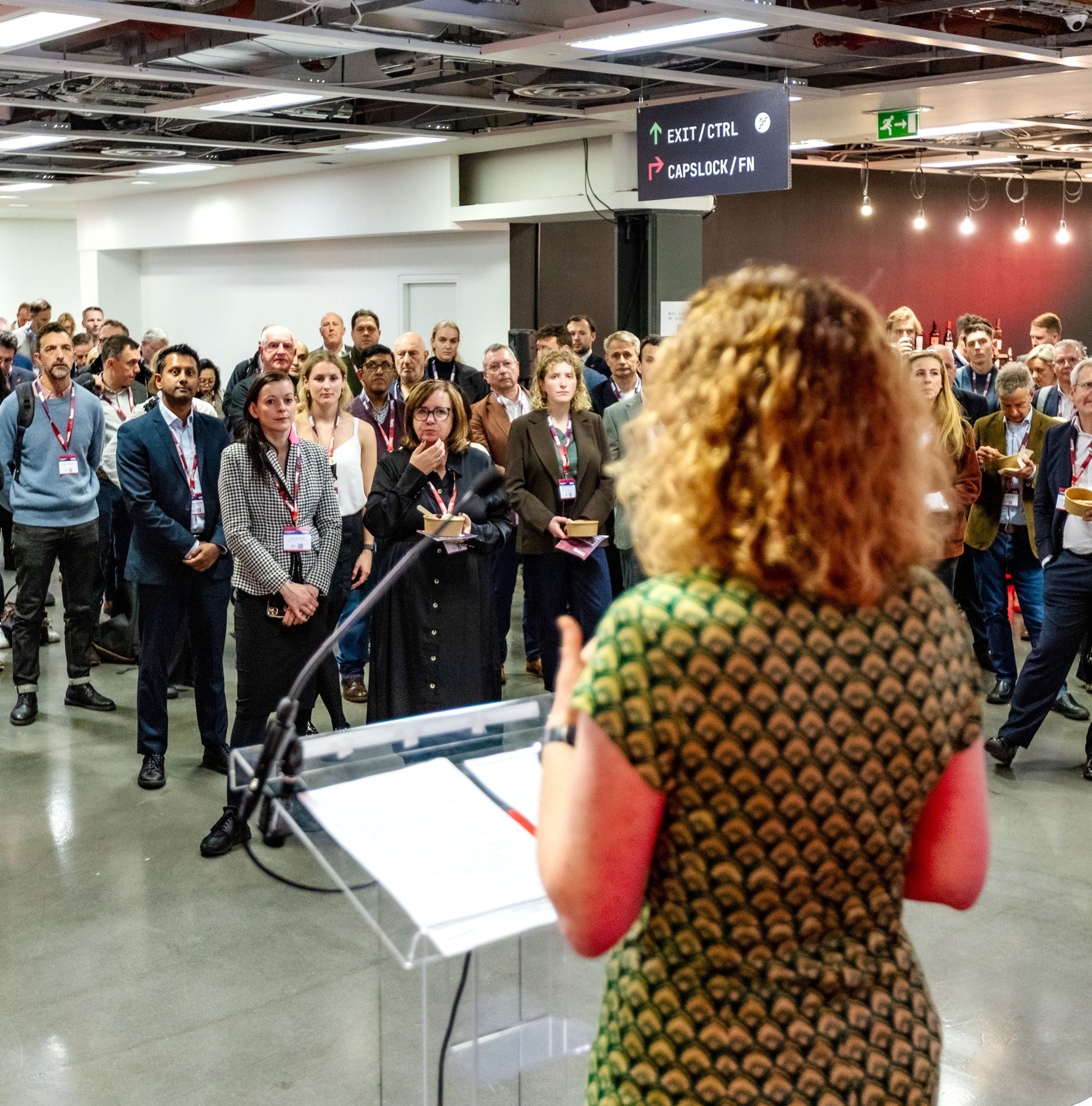 An audience listens to a speaker at Investment Futures 2025