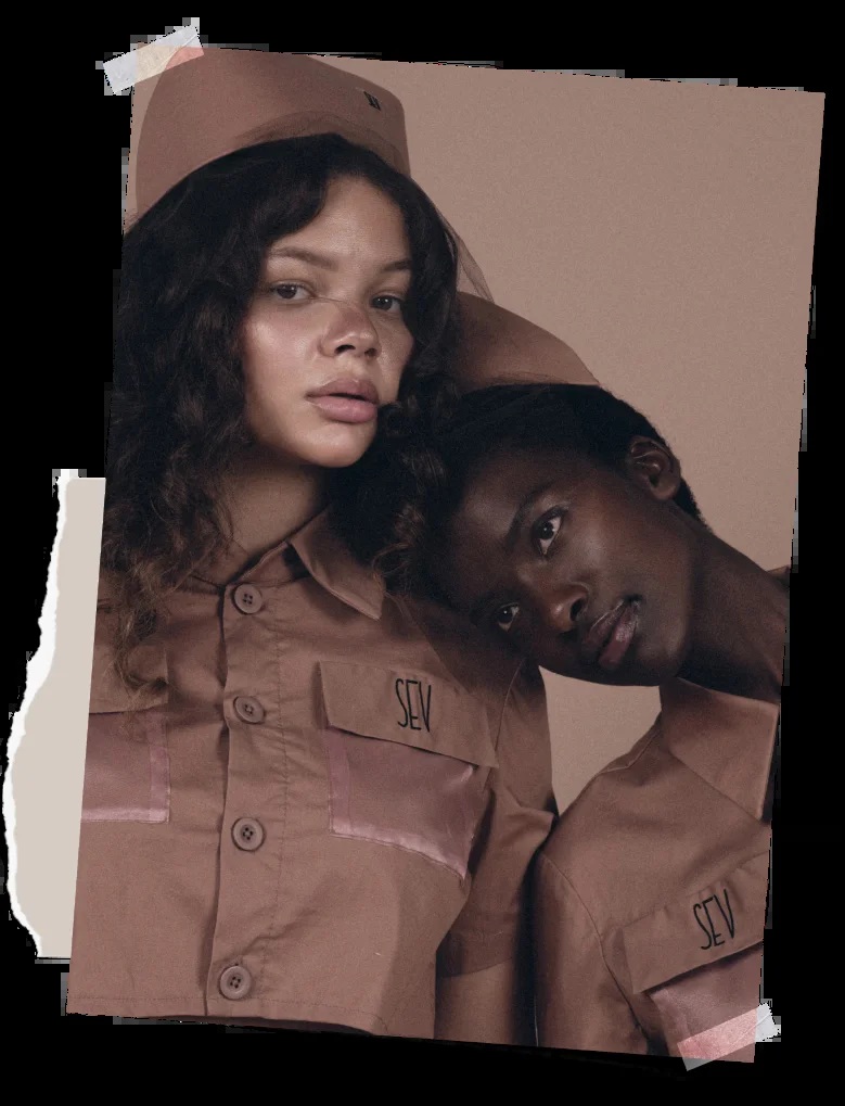 SEV promotional portrait of two people wearing brown SEV uniforms