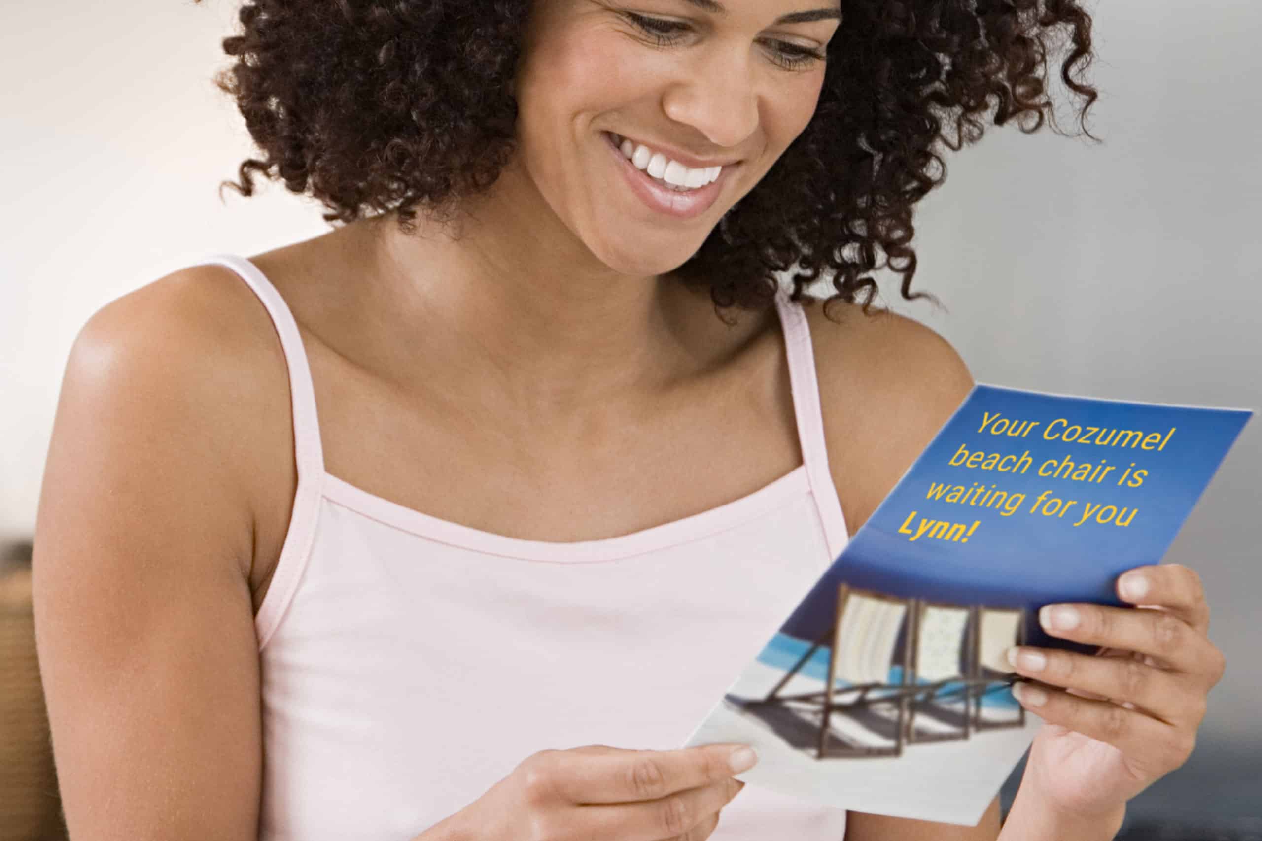 A personalized travel mailer addresses its recipient by name and offers a Cozumel holiday