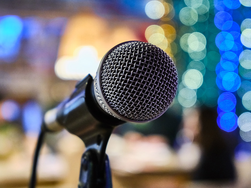 Close-up of a microphone, the illustrative photograph used on the SMART website
