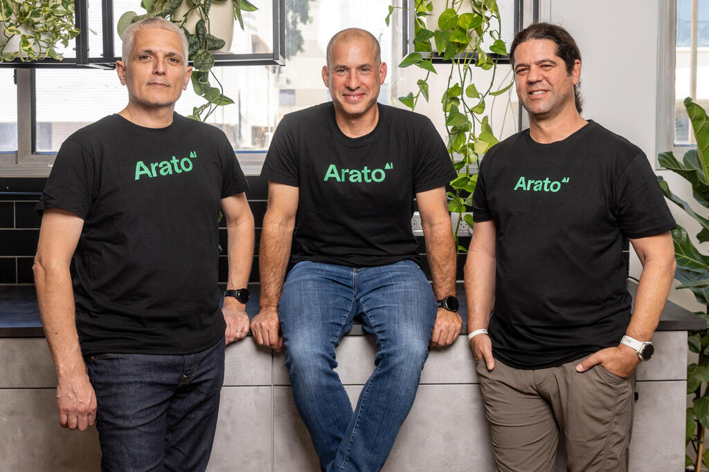 Arato co-founders Hilik Paz, Shahar Erez and Tal Salmona wearing Arato shirts in an office