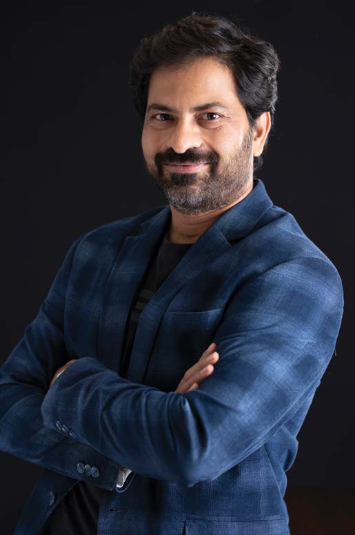 An archival photograph of Shailesh Goswami wearing a blue jacket