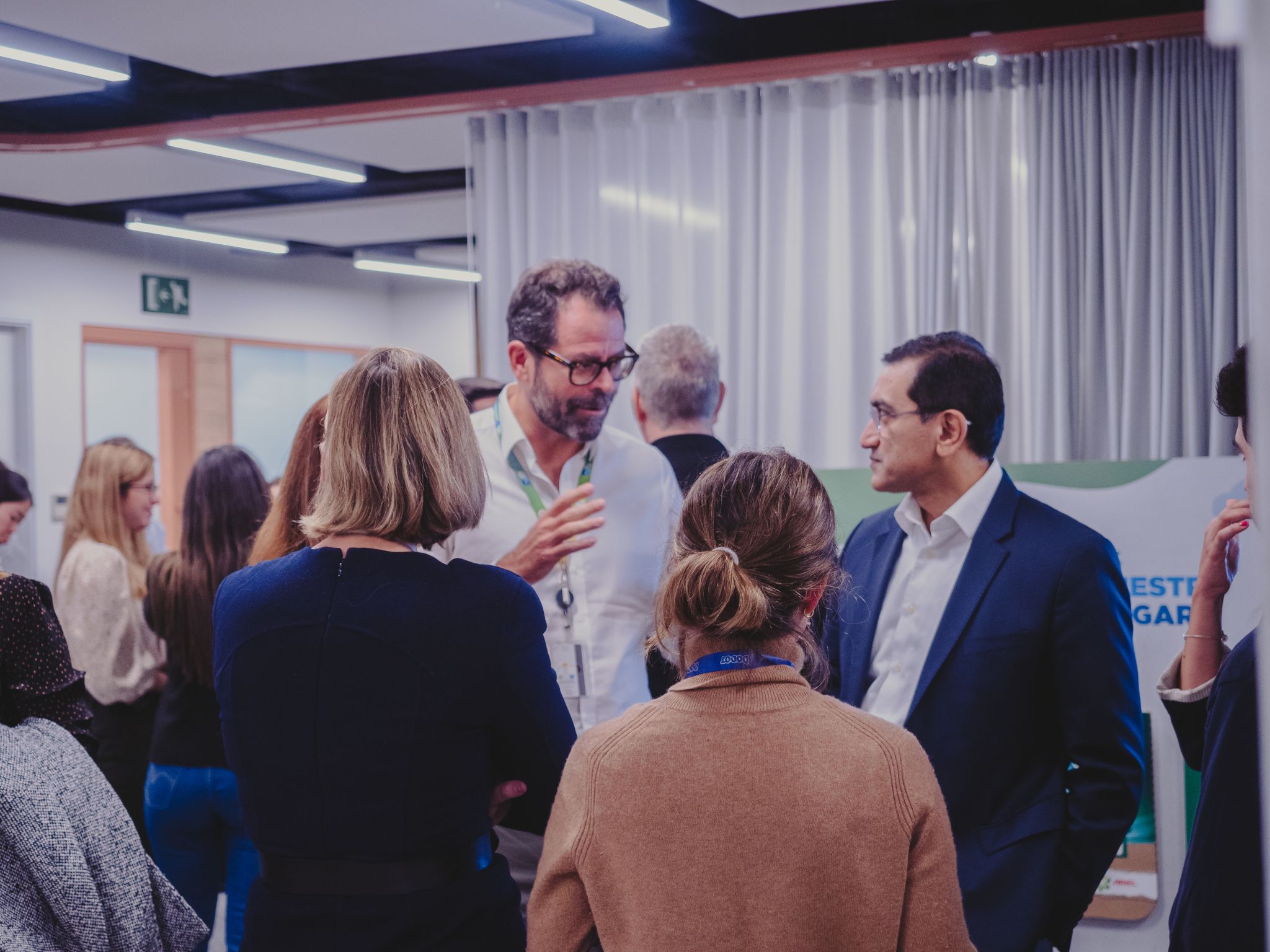 Shailesh Jejurikar, at right, in conversation with P&G employees in Spain