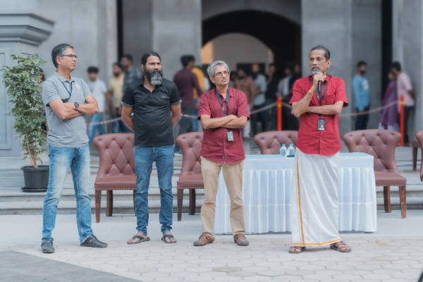 Rajesh Ganesan, Mani Vembu, Shailesh Davey and Sridhar Vembu standing together at a Zoho gathering