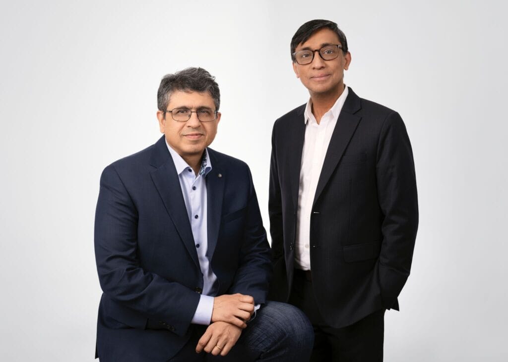LightSpun co-founders Deepak Ramaswamy, seated at left, and Shaju Puthussery, standing at right