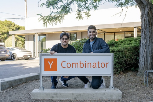 Vendra founders Anish Bhardwaj and Shan Mohta behind the Y Combinator sign