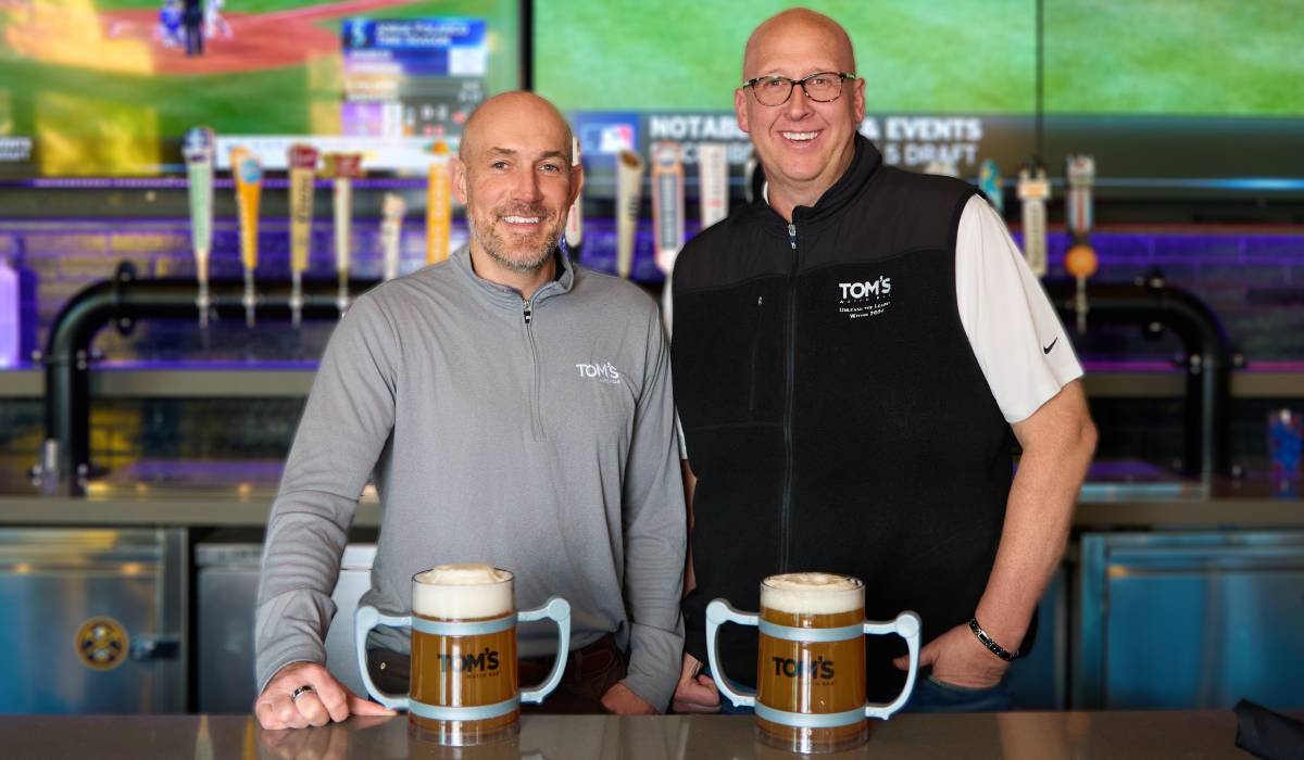 Brooks Schaden and Shannon McNiel standing behind the bar at Tom's Watch Bar