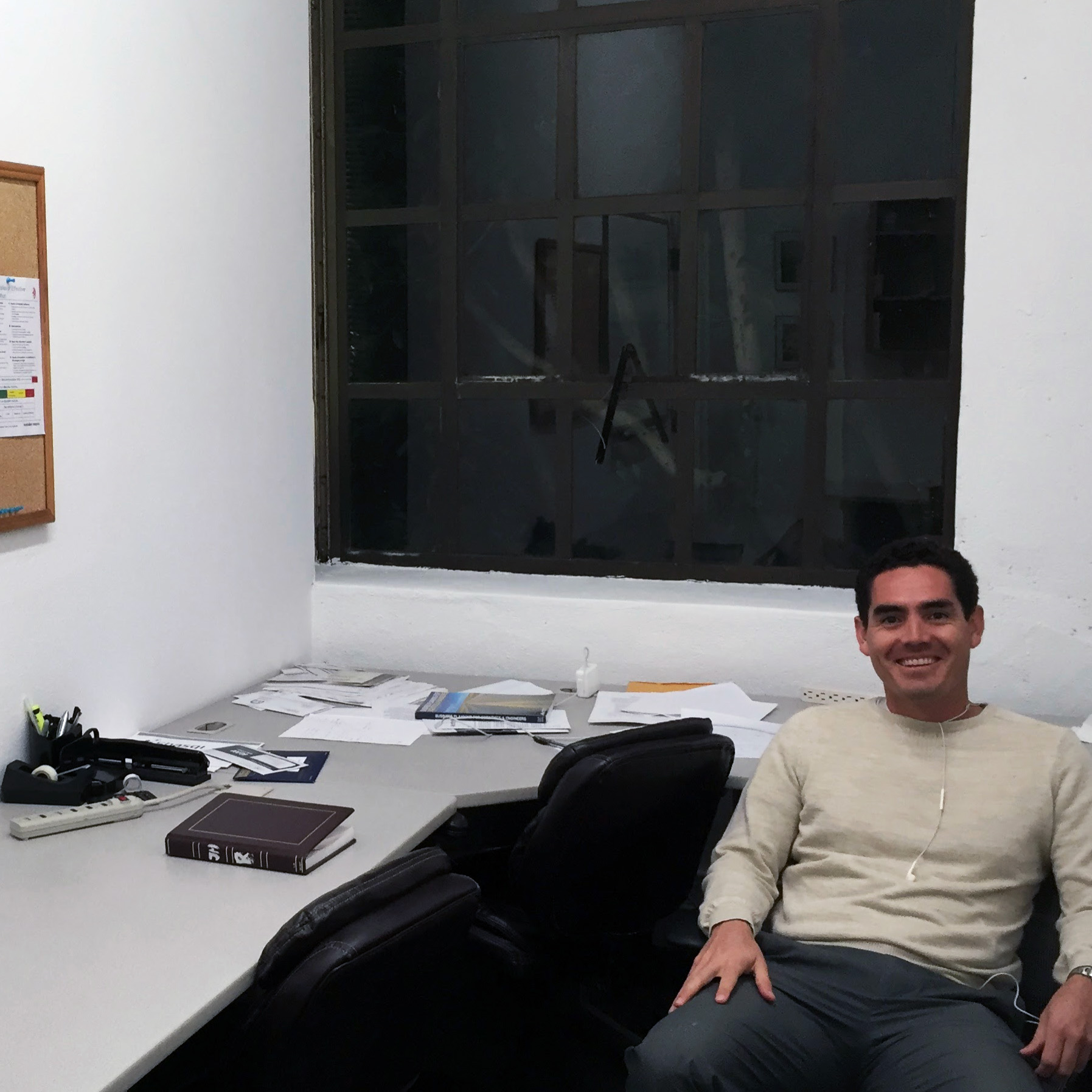 Shasqi founder José M. Mejía Oneto sitting at a desk in the company's early office