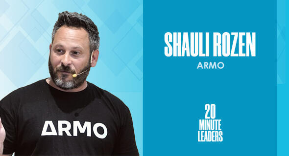 Shauli Rozen speaking in an ARMO shirt beside his name and the 20 Minute Leaders mark