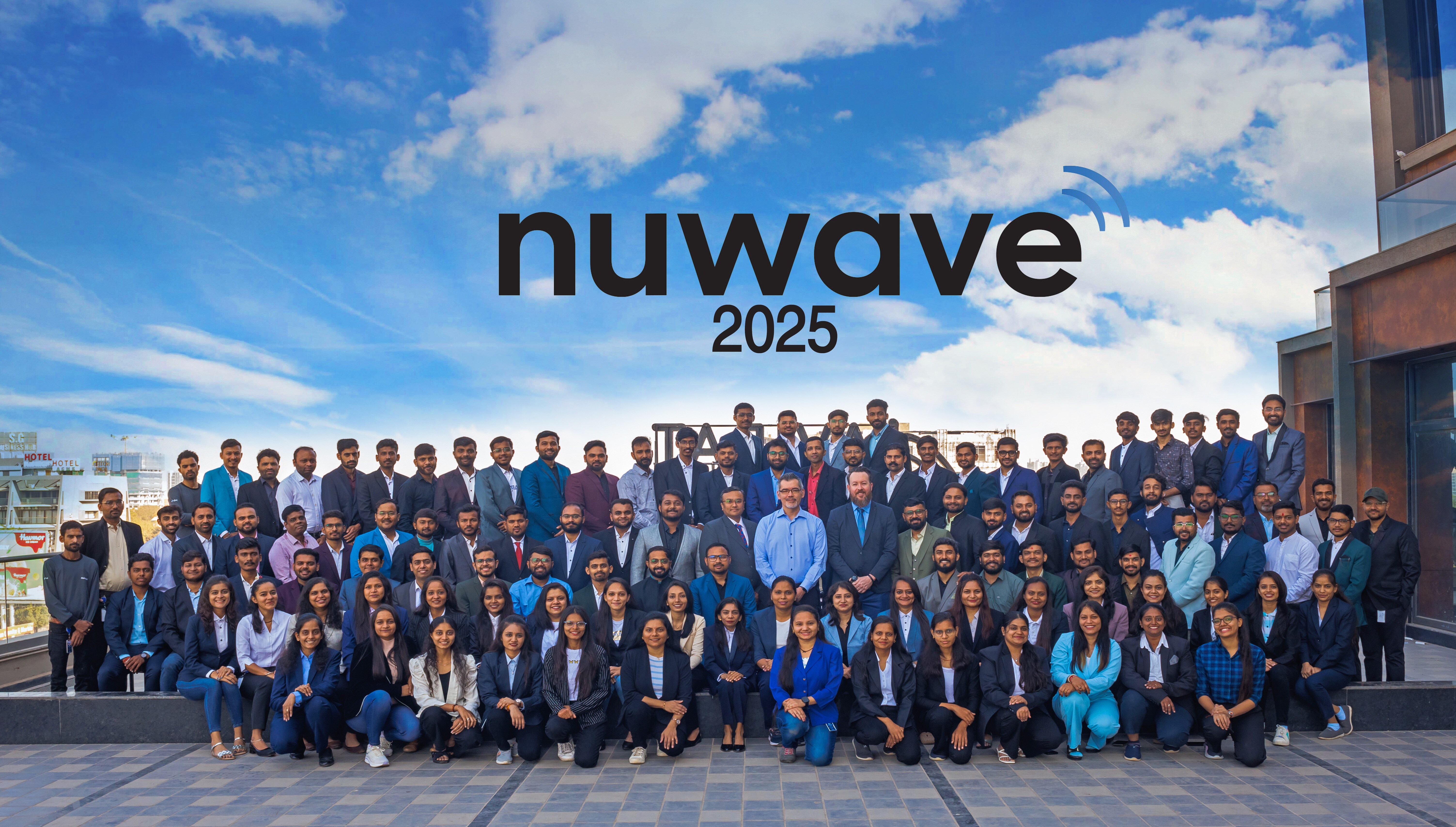 NUWAVE’s development team gathered outdoors for a group photograph marked 2025