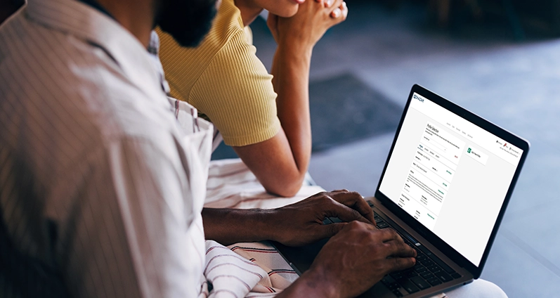 DigiHive promotional photograph showing people using a banking interface on a laptop