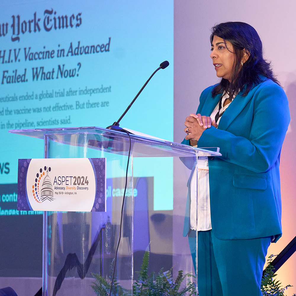 Shehnaaz Suliman speaking behind a lectern at the ASPET 2024 annual meeting