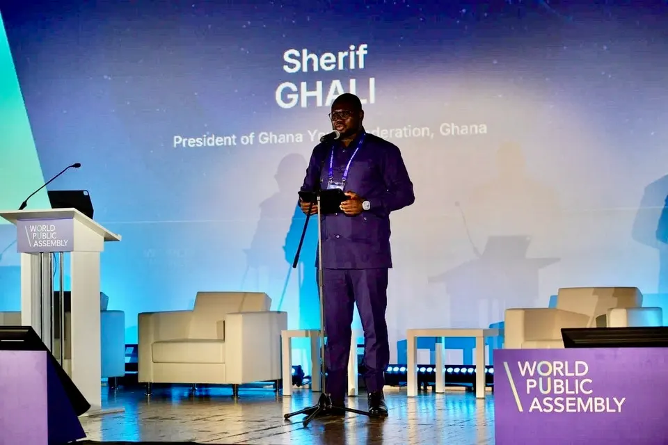 Sherif Ghali speaking on stage at the Second World Public Assembly in Moscow
