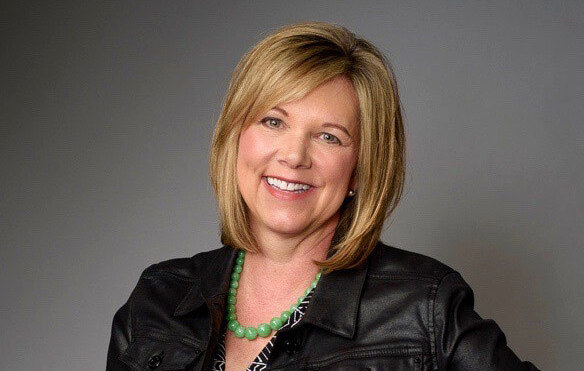 Sherry Lowe seated for a professional editorial portrait