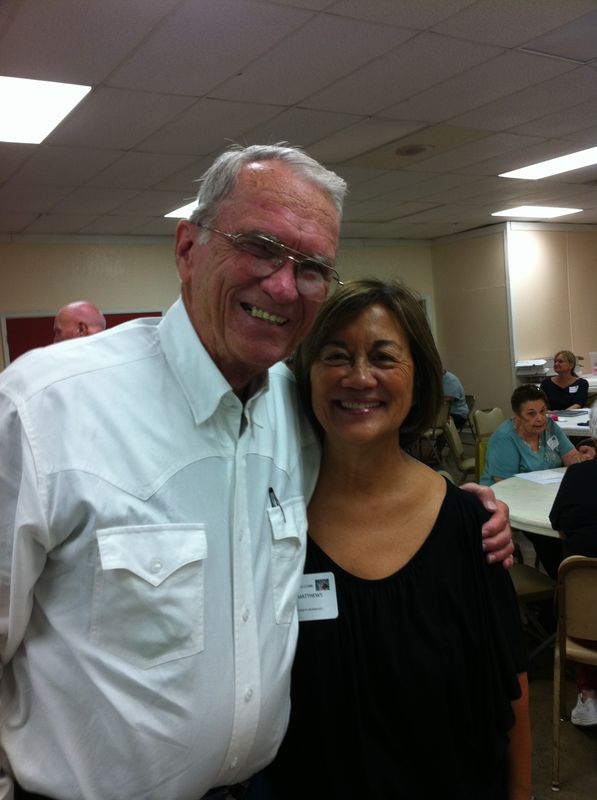 Sherry Matthews smiling with an attendee at a Waco State Home alumni event