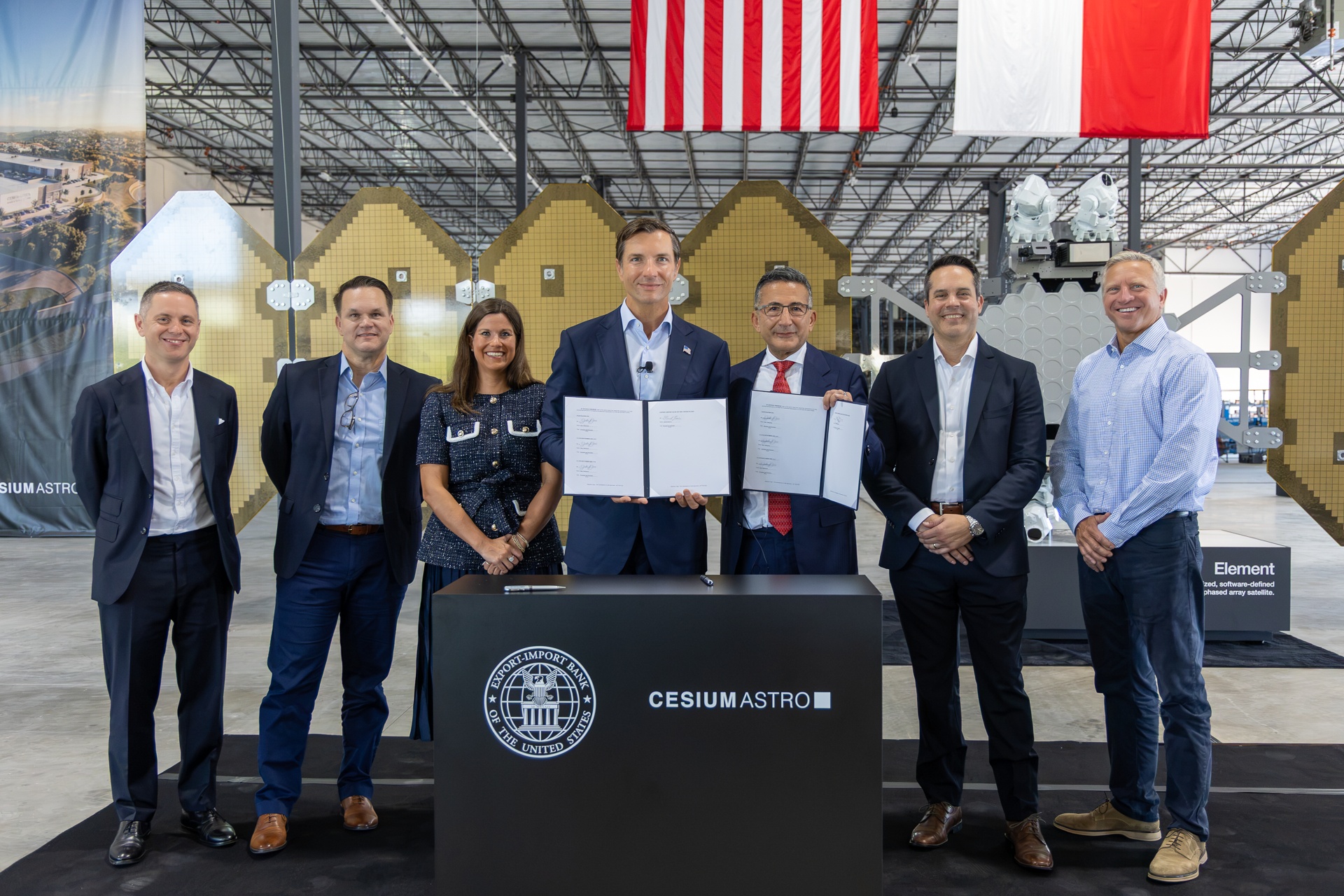 Shey Sabripour and EXIM chairman John Jovanovic hold signed agreements with colleagues at CesiumAstro’s future Texas manufacturing complex