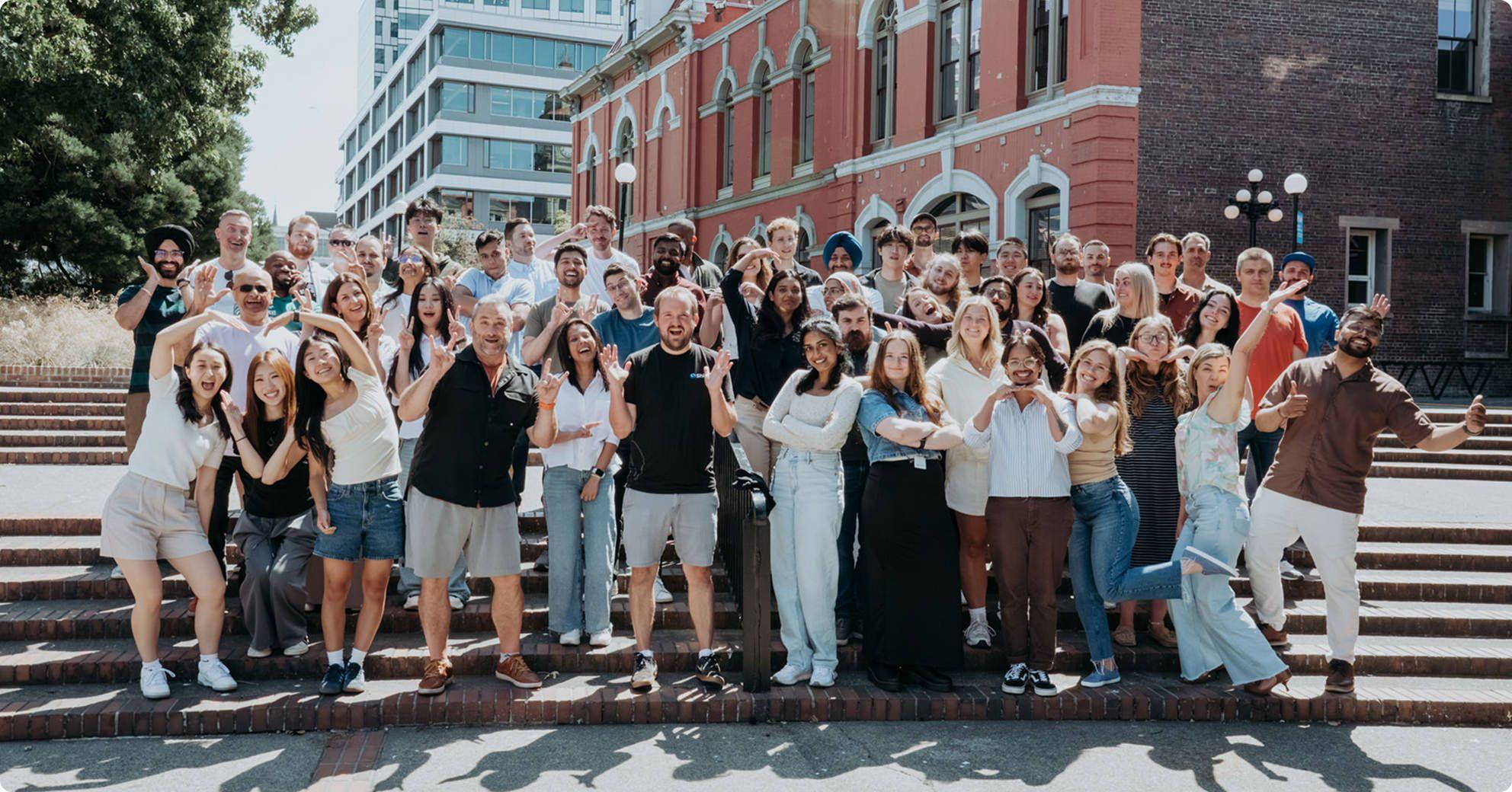 Shift team gathered on outdoor steps in Victoria