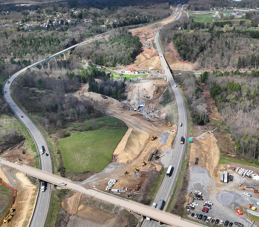 Aerial view of highway bridge replacement work beside an operating interstate in Pennsylvania