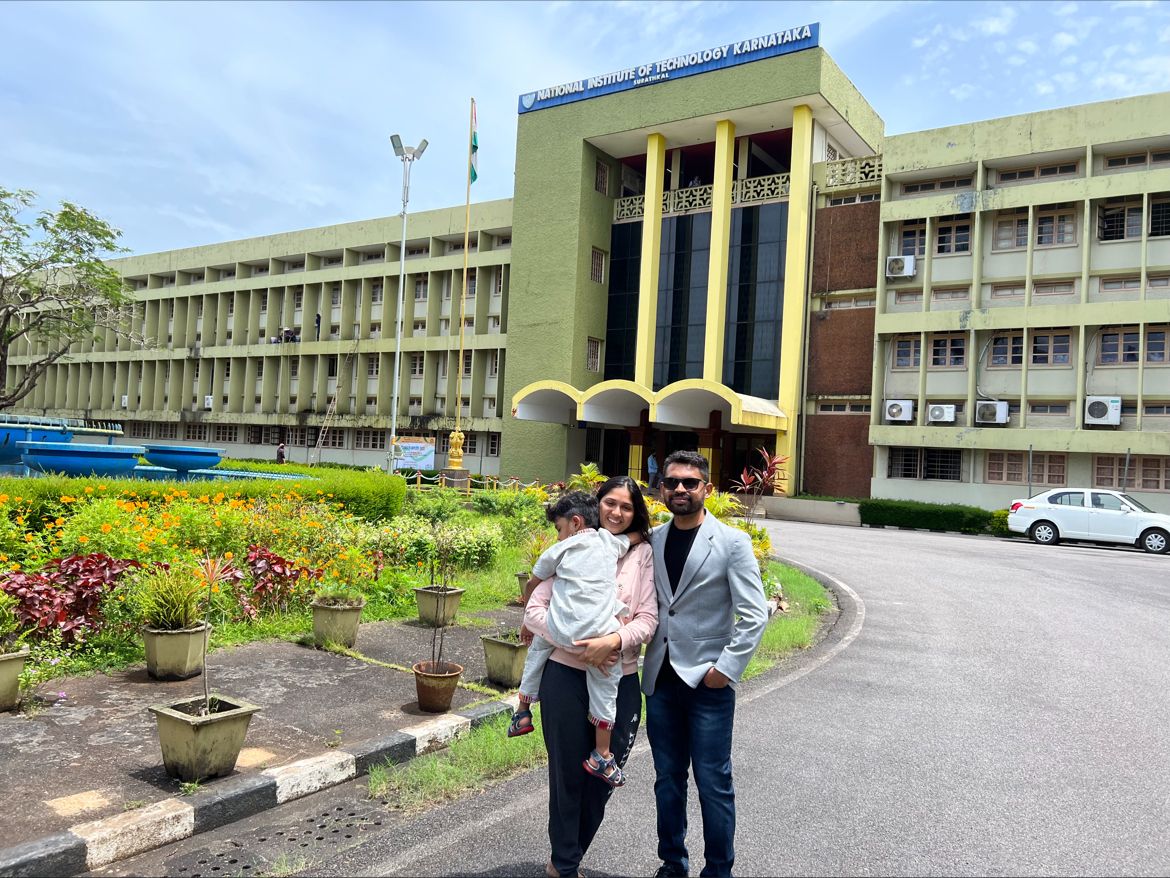 Shivaprasad KT with his wife and son outside the NITK Surathkal building during his return to recruit graduates