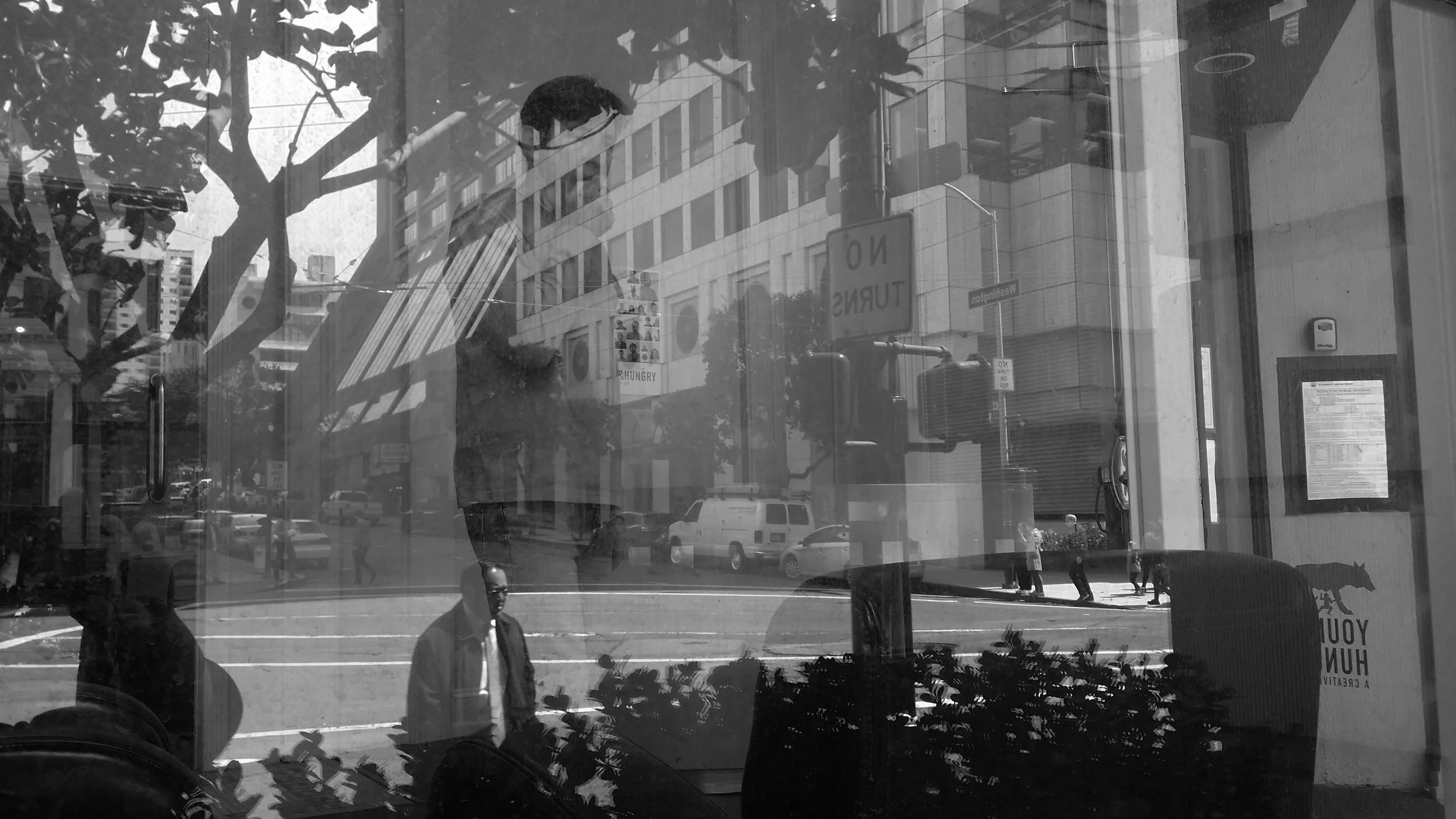Black-and-white image from the Shocase creative project archive, with street reflections layered across an interior.