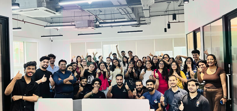 CodeVyasa colleagues gathered together in an office