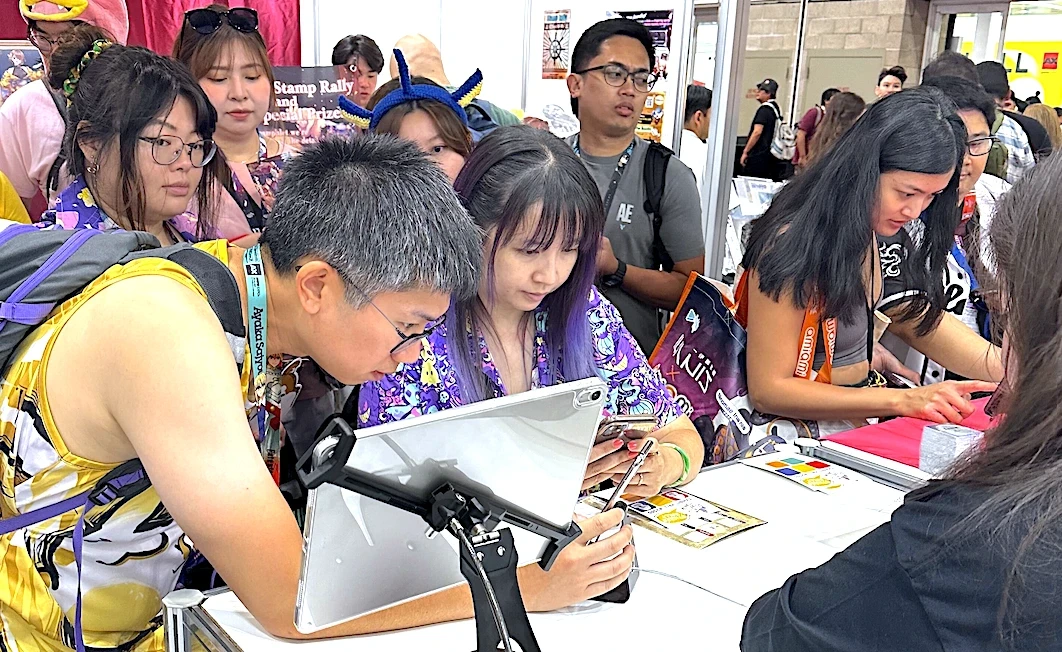 Visitors and staff at the Avvy booth during Anime Expo 2025