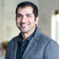 Sid Bhatt in a gray jacket, in an archival Aarki portrait
