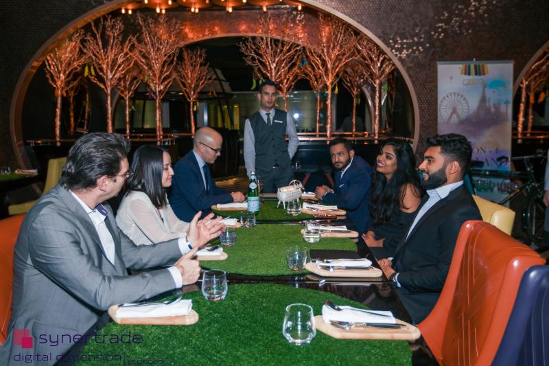 Procurement professionals gathered around a dinner table at Carnival by Trèsind in Dubai