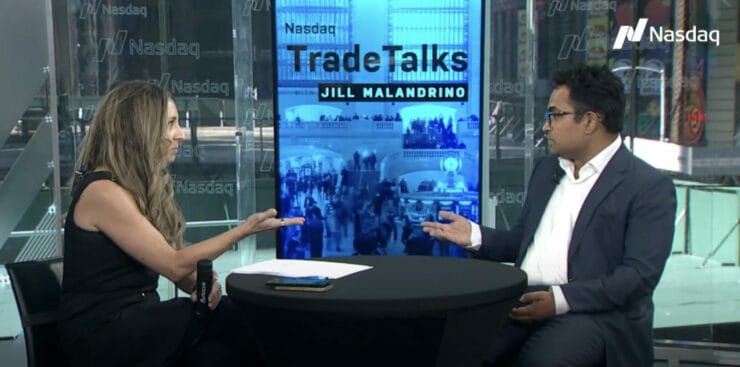 Sid Jha, seated at right, speaking with Jill Malandrino at a Nasdaq TradeTalks interview table