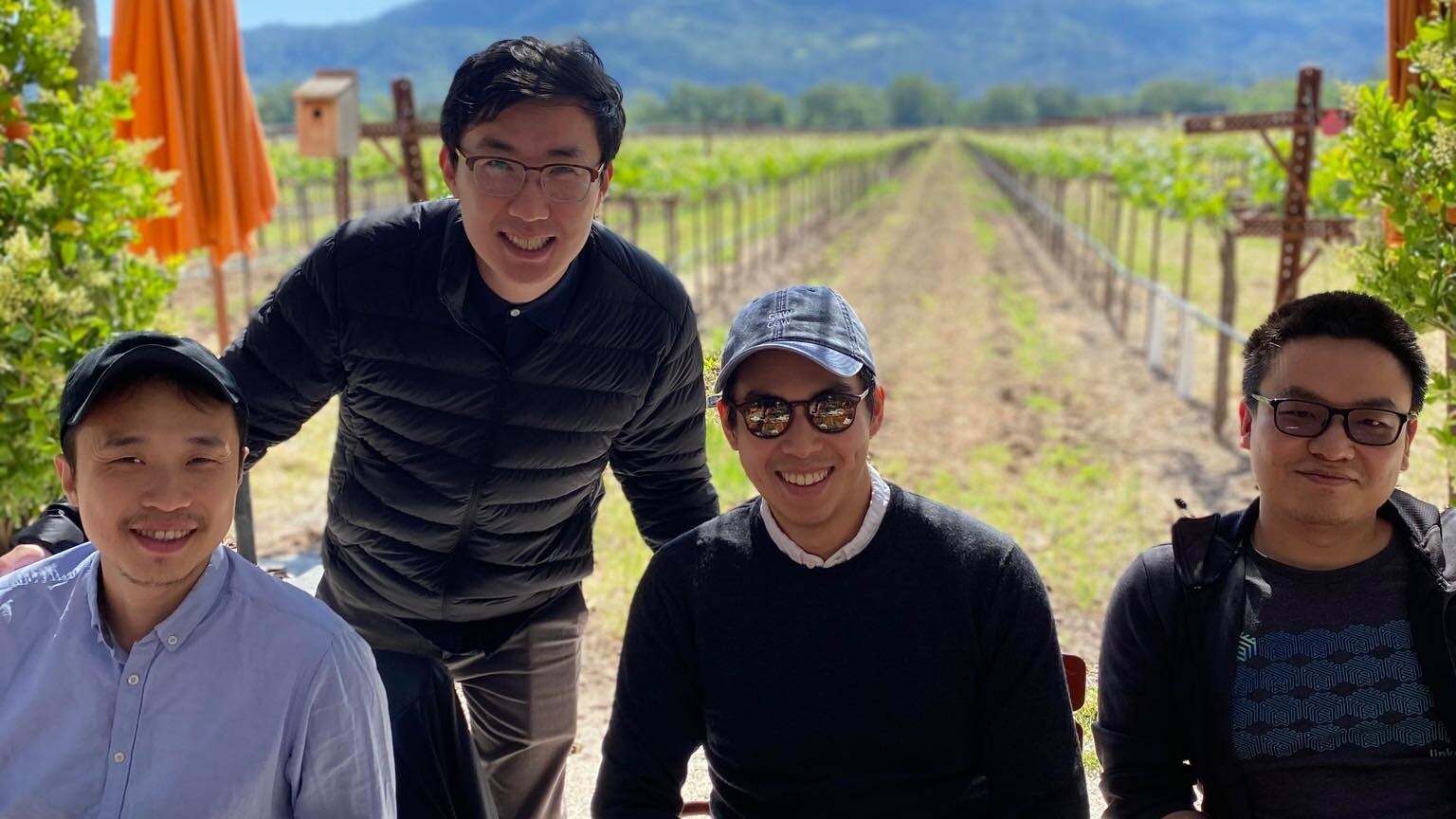Magic Eden co-founders Sidney Zhang, Jack Lu, Zhuoxun Yin and Zhuojie Zhou seated together outdoors at a vineyard