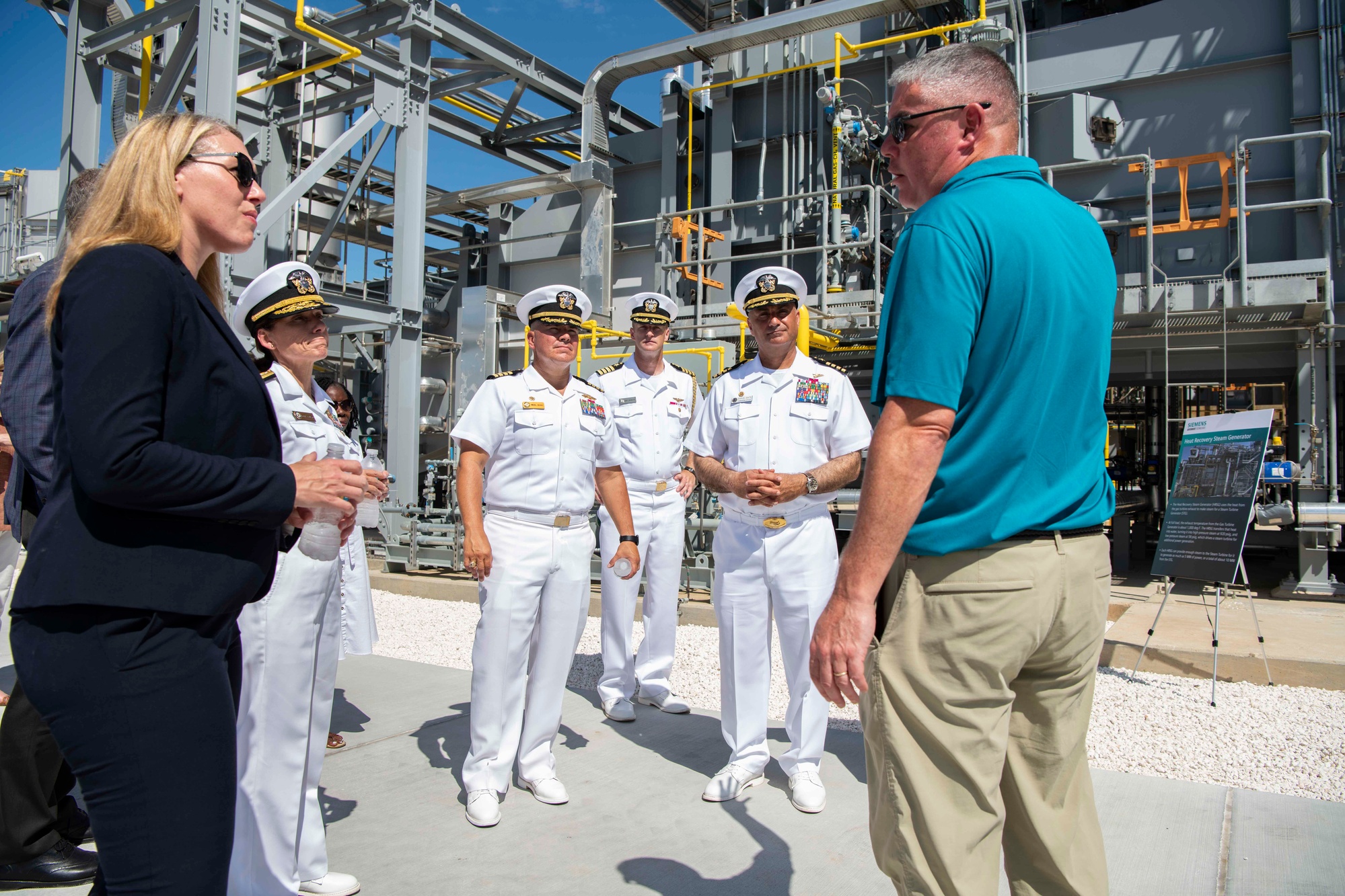 Siemens Government Technologies project manager David Ling explaining the Guantanamo Bay power plant to Navy officials