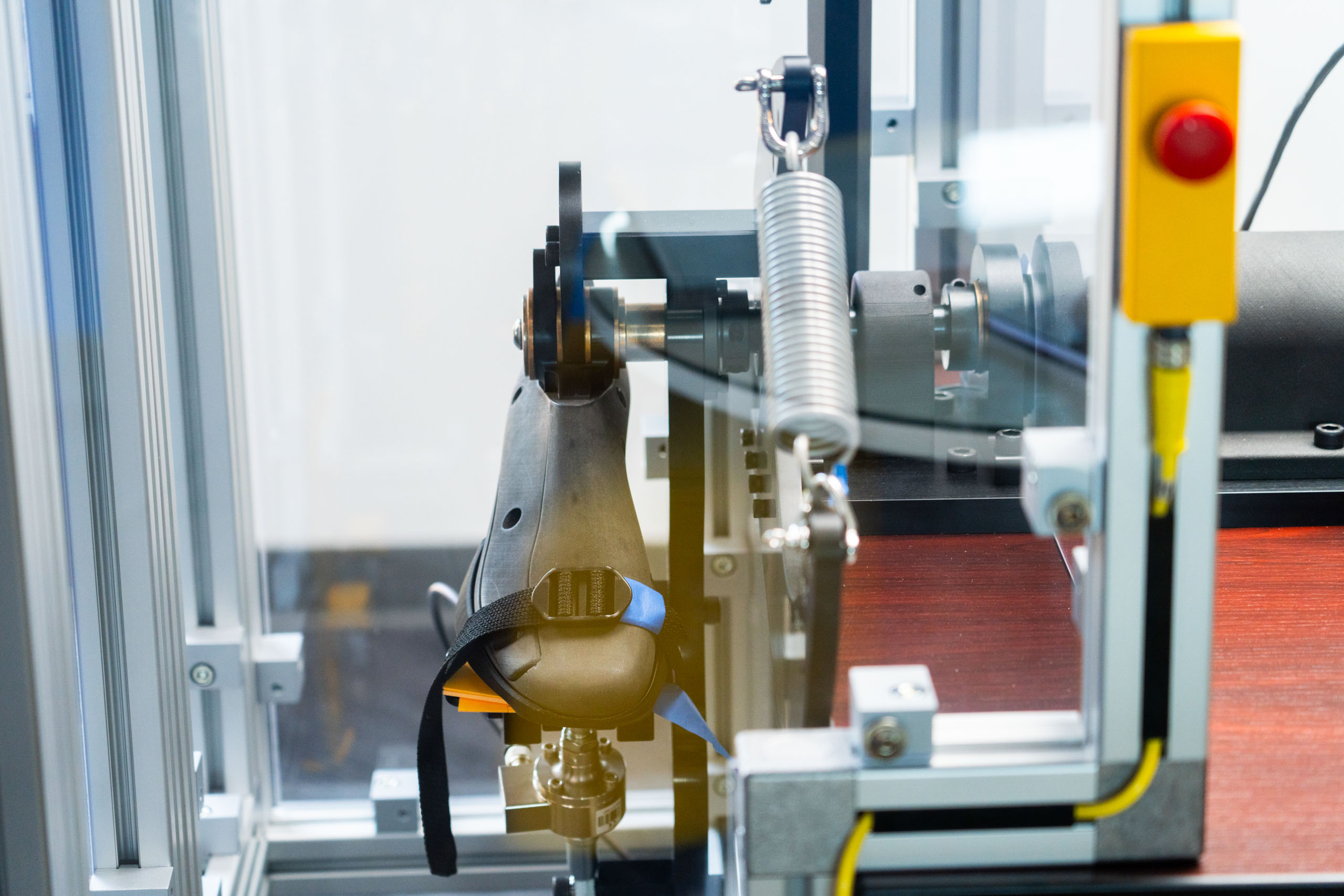 Synthetic foot, spring, and mechanical components in Sigma Design’s running-exoskeleton test fixture